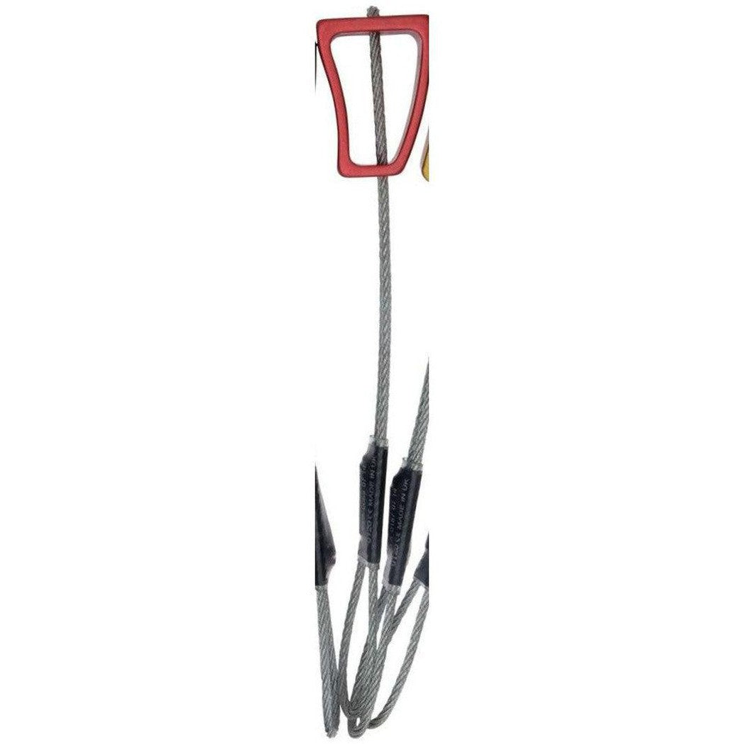 A close-up of the Wild Country Rock climbing protection device with a red top and black spikes against a white background.