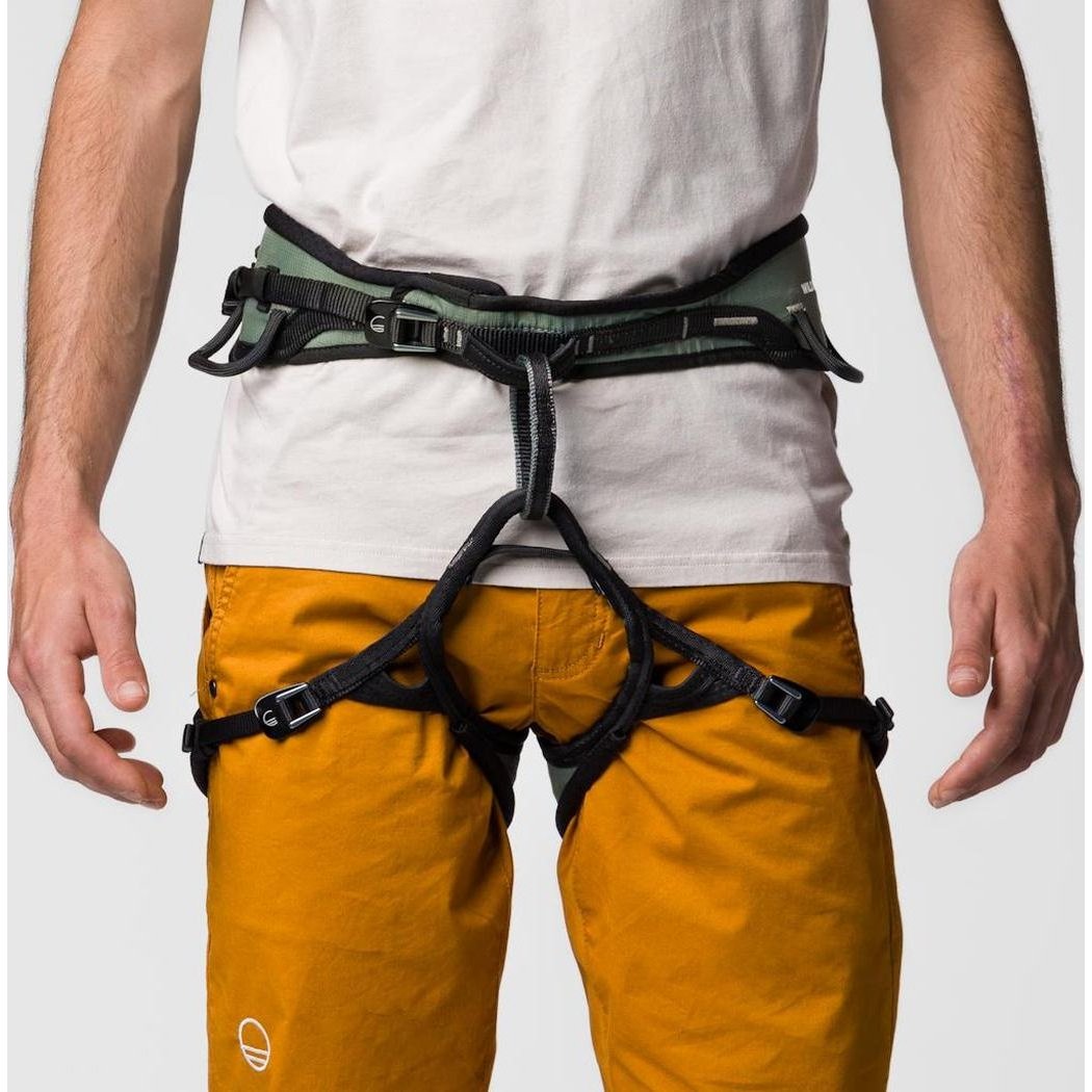 A front view of the Wild Country Session 2.0 Men's harness on a man wearing yellow pants against a plain background.