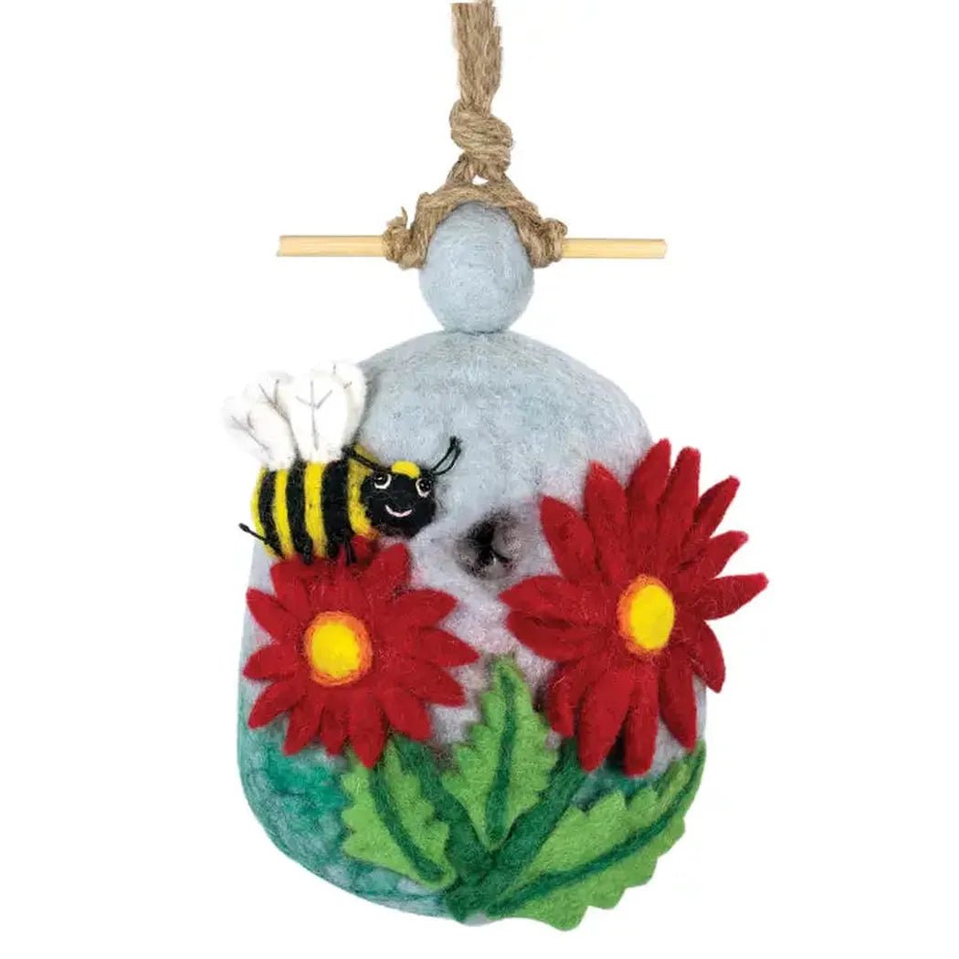 A hanging Wild Woolies Bumble Birdhouse with red flowers and a bee, shown from front against a white background.