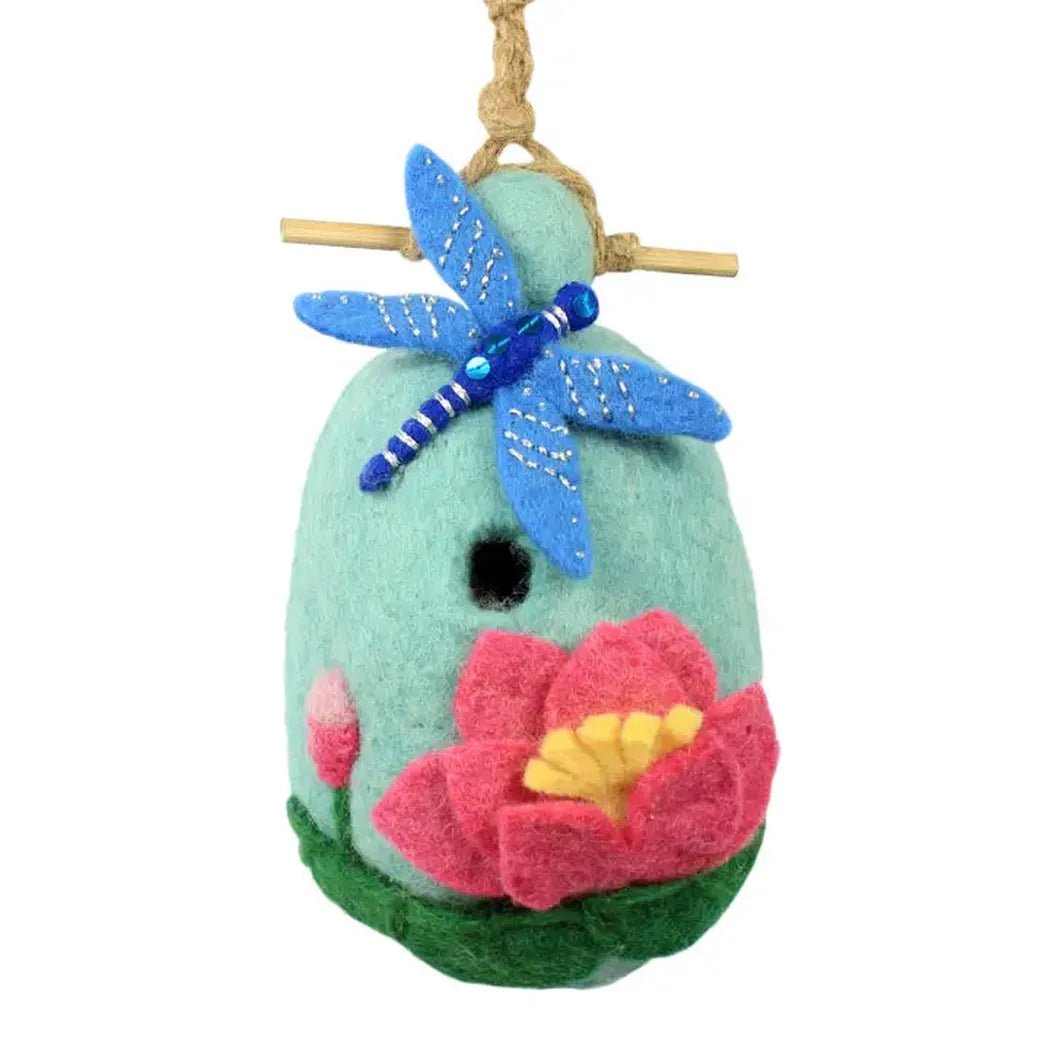 A light blue Wild Woolies Lotus Dragonfly Birdhouse with a blue dragonfly and pink flower hangs from a rope.