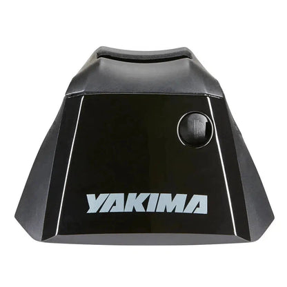 A black Yakima RidgeLine car rack system with a single button control on the front, photographed from a top-down angle against a white background.