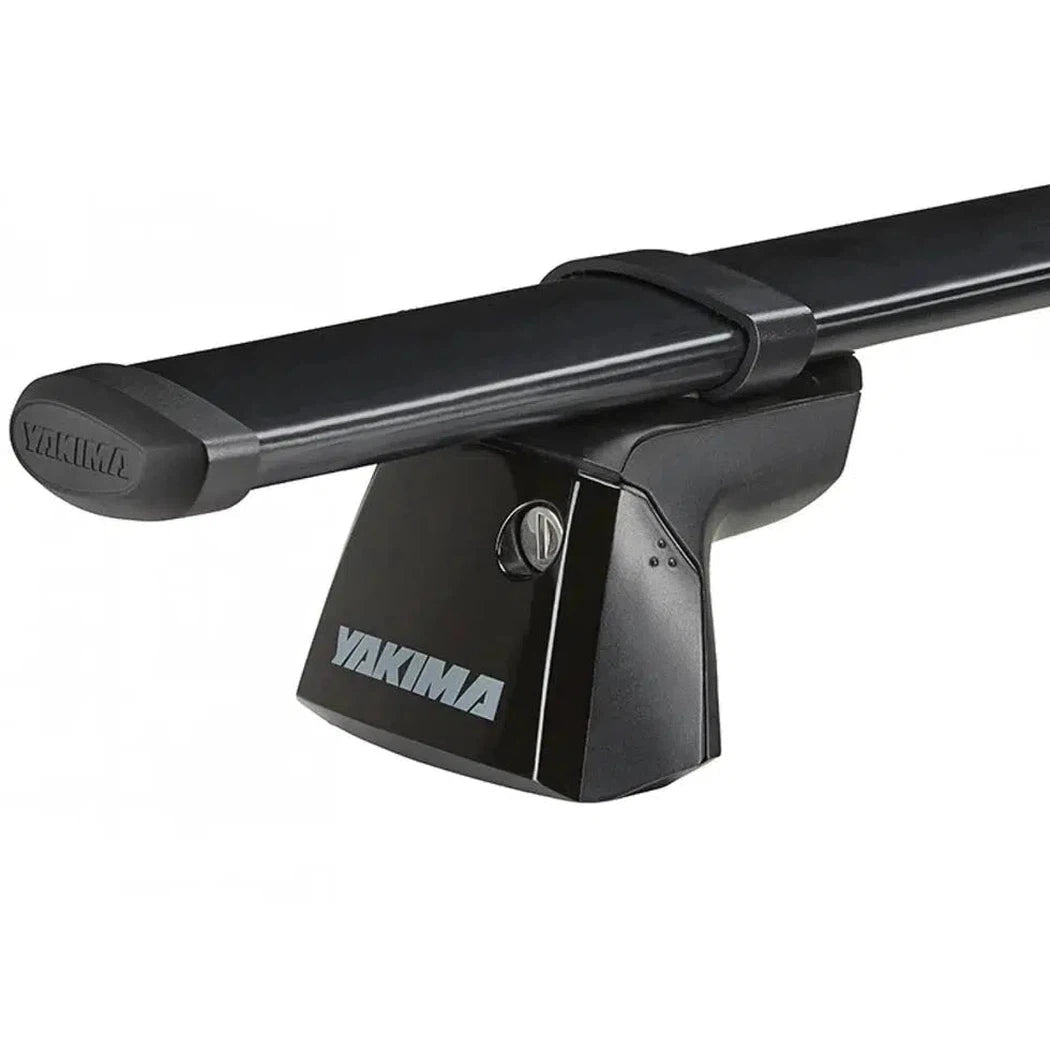 A black Yakima RidgeLine car rack system with a secure mounting base and branded logo, photographed from a side angle against a plain white background.
