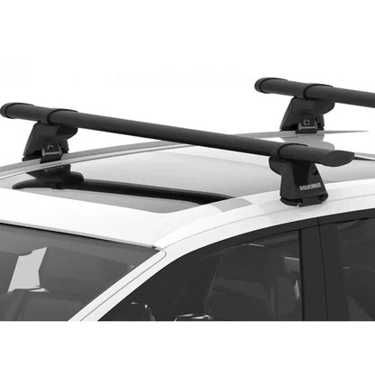 A top-down view of the Yakima RidgeLine (4 Pack) car rack system installed on a white SUV roof.