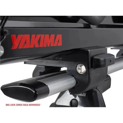 Close-up of the Yakima Showdown car rack with a black frame and silver clamp, showing the SKS lock core sold separately text.
