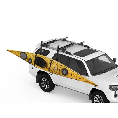 A yellow Yakima Showdown kayak mounted on a white SUV with roof racks, shown from a side angle against a plain white background.