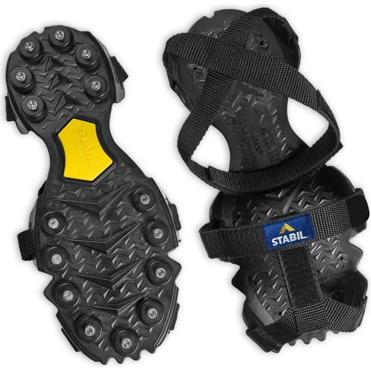 A top-down view of the black and yellow YakTrax STABIL Max Cleat with straps and metal cleats visible.